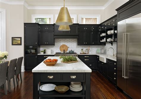 black handles on white kitchen cabinets with stainless steel appliances|black bottom cabinets white upper.